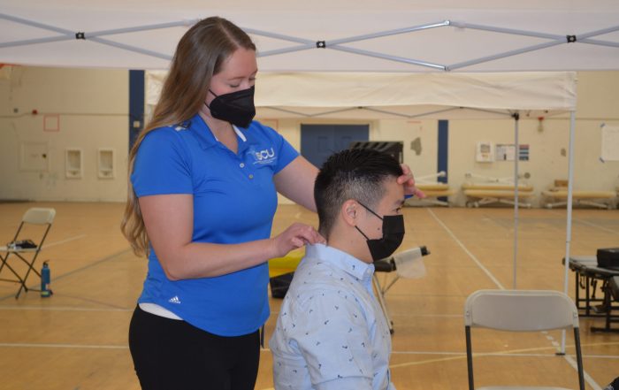 A photo of a patient receiving treatment at the SCU Health Tent Event