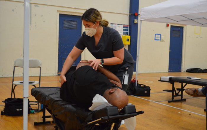A photo of a patient receiving treatment at the SCU Health Tent Event