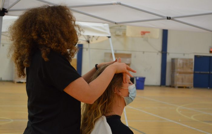 A photo of a patient receiving treatment at the SCU Health Tent Event
