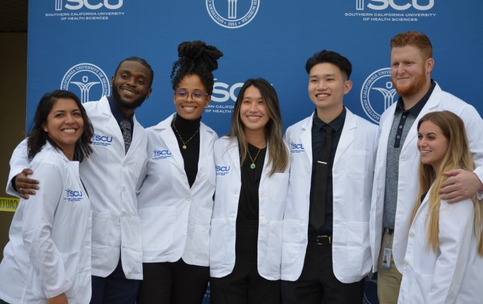 A group photo of SCU students after receiving their white coats